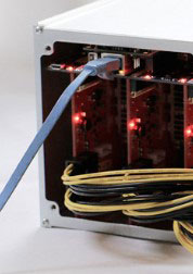 An image of a LAN cable pluged to a Pasc mining ASIC device.